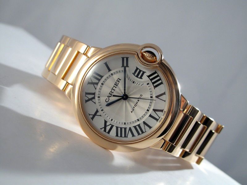 The blue hands and Roman numerals hour markers are contrasted to the silver dial of fake Cartier.