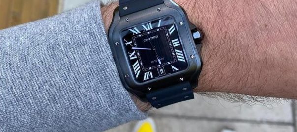 The black dial fake watch has Roman numerals.