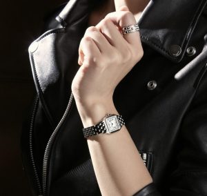 The white dial fake watch is decorated with diamonds.