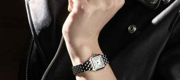 The white dial fake watch is decorated with diamonds.